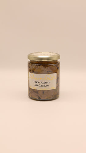 Ein 270-g-Glas mit Conserve Conti Funghi pleurotes alla contadina und einem goldenen Deckel. Das beigefarbene Etikett unterstreicht den authentischen sizilianischen Landhausgeschmack.