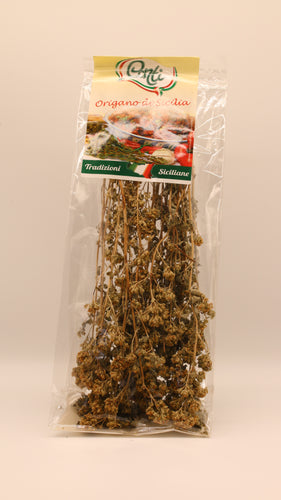 Ein durchsichtiger Plastikbeutel mit getrockneten Oregano-Zweigen, beschriftet mit 